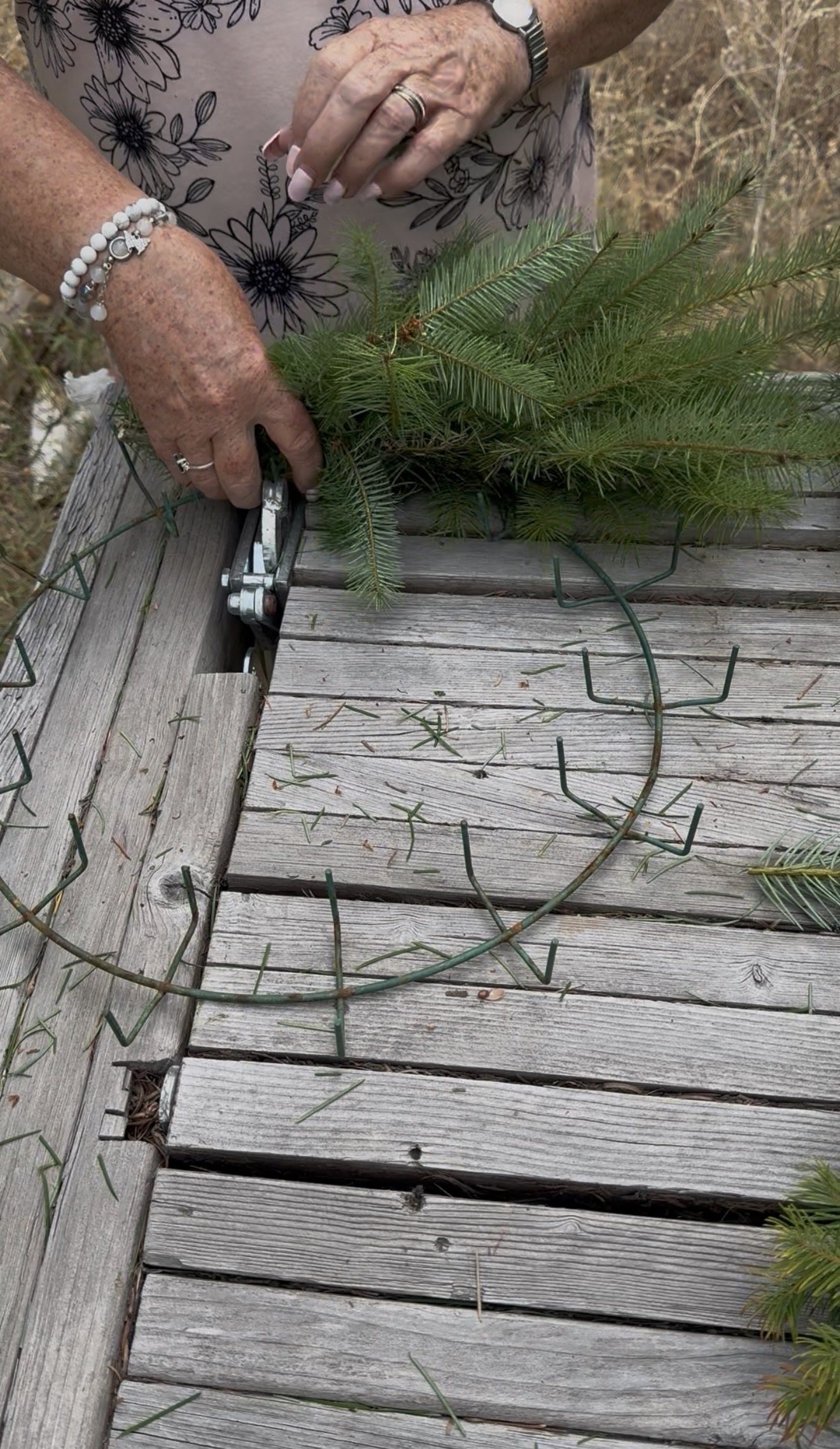Hand-bound noble fir wreath on the workbench